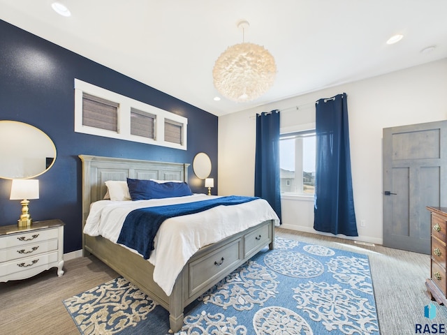 bedroom with recessed lighting and baseboards