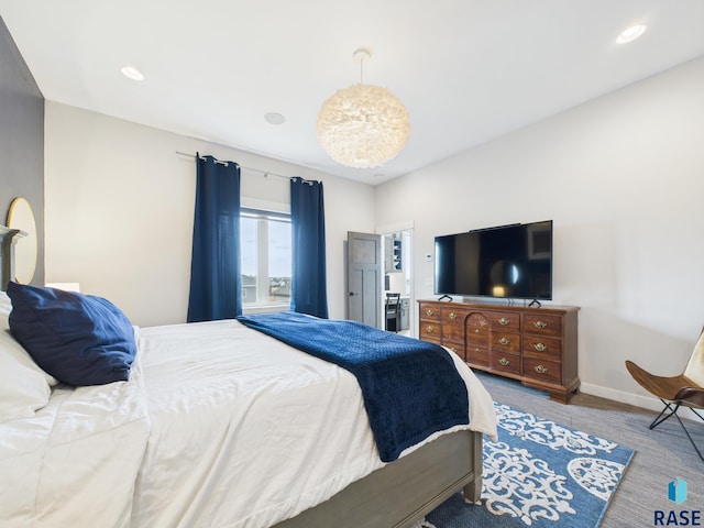 carpeted bedroom featuring recessed lighting and baseboards