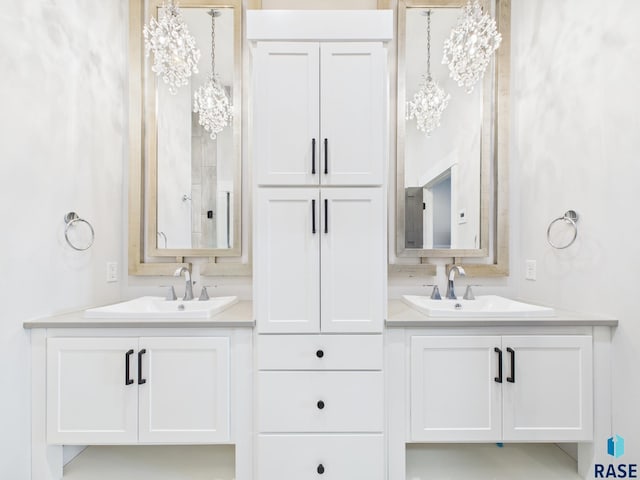 bathroom with a sink and two vanities