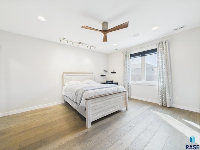 bedroom with visible vents, baseboards, recessed lighting, wood finished floors, and a ceiling fan