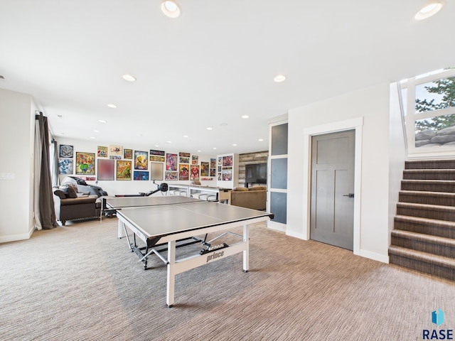 recreation room with recessed lighting, baseboards, and light colored carpet