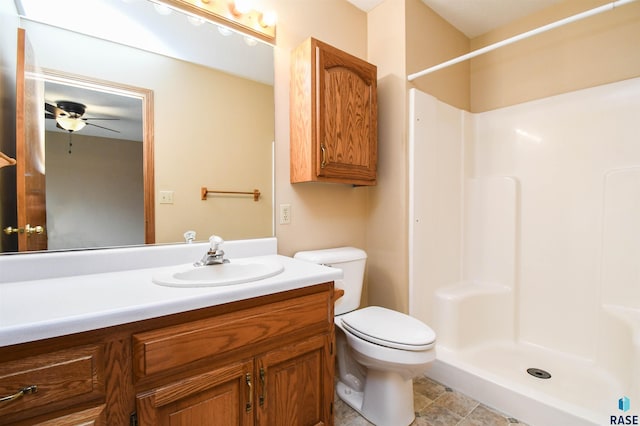 full bathroom with a shower, toilet, ceiling fan, and vanity