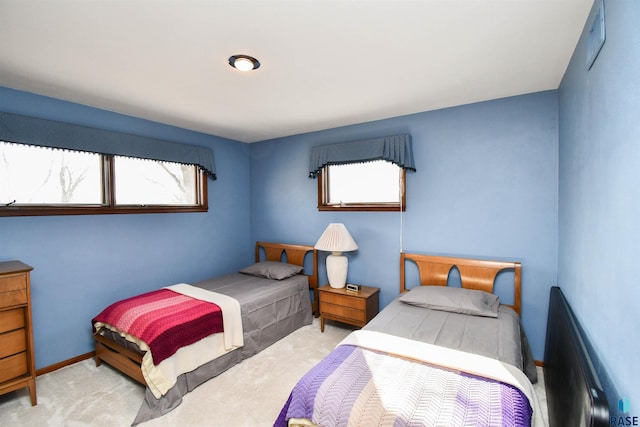 bedroom with carpet flooring and baseboards