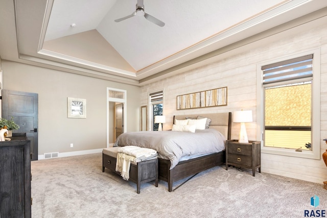 carpeted bedroom with baseboards, visible vents, high vaulted ceiling, and ceiling fan