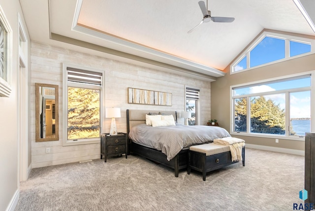 bedroom featuring carpet flooring, multiple windows, and baseboards