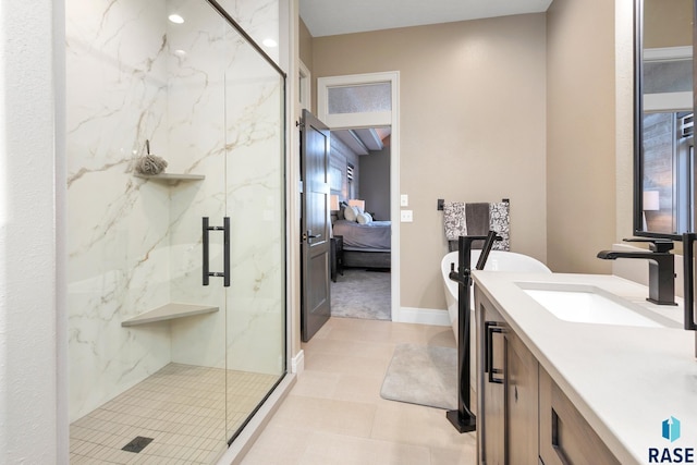 full bathroom featuring a marble finish shower, connected bathroom, baseboards, a freestanding bath, and vanity