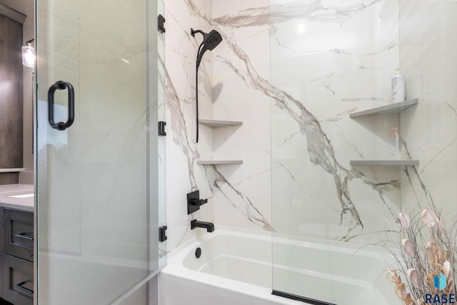 full bathroom featuring vanity and bath / shower combo with glass door