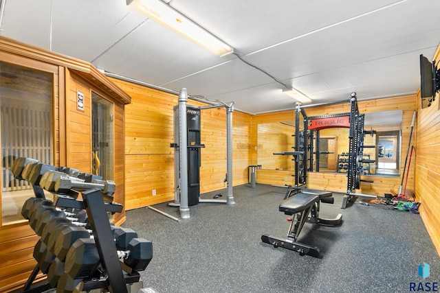 workout room with wood walls