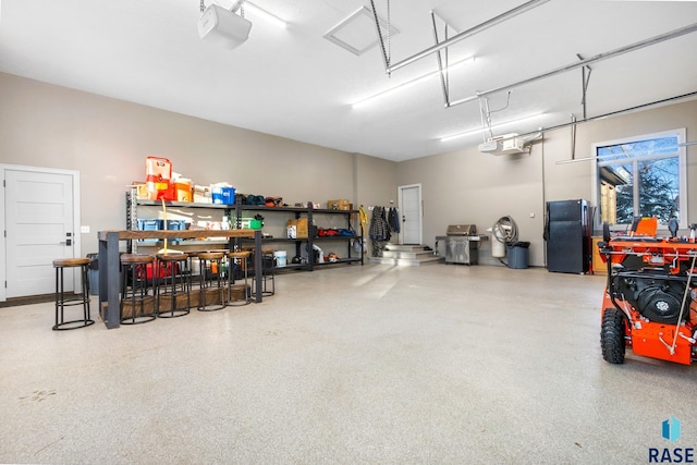 garage with freestanding refrigerator