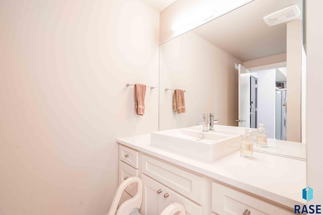 bathroom featuring visible vents and vanity