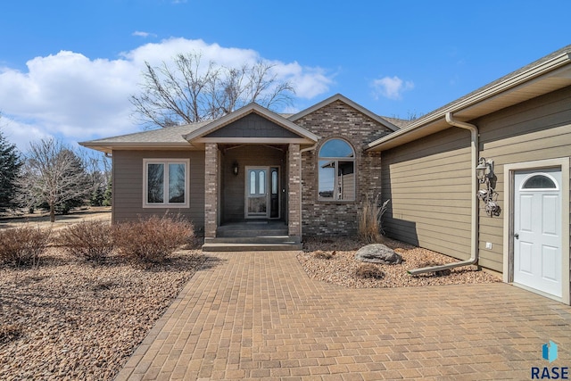 exterior space with brick siding