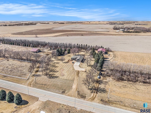 birds eye view of property with a rural view