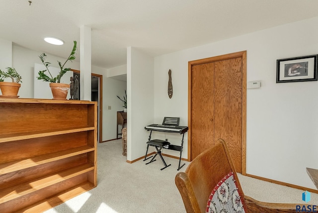 interior space featuring carpet flooring and baseboards