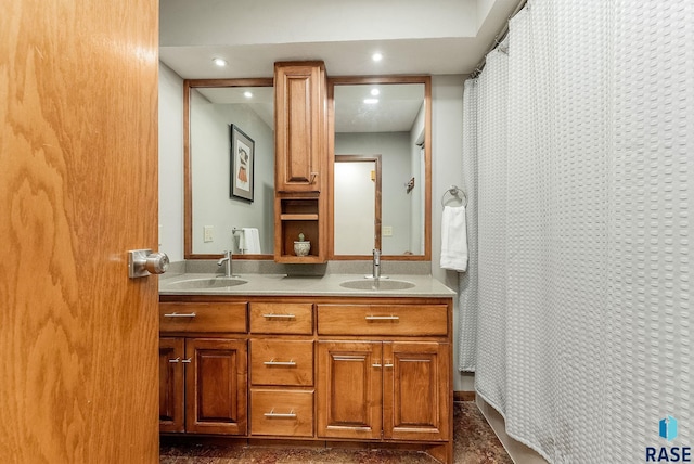 bathroom featuring double vanity, a shower with curtain, recessed lighting, and a sink