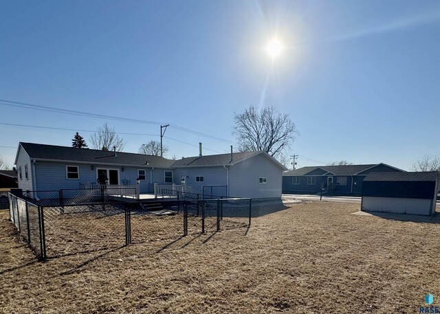 rear view of house featuring a deck