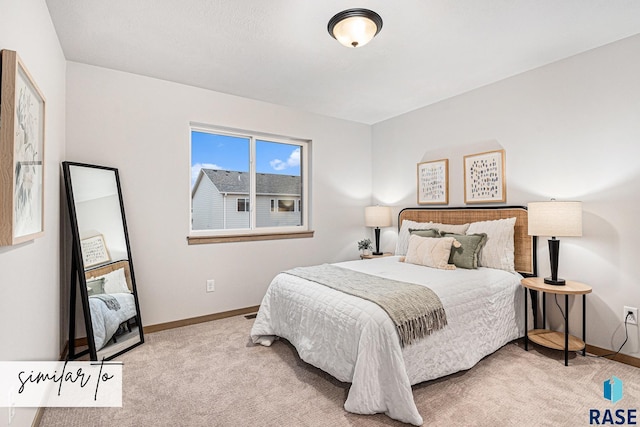 bedroom with carpet flooring and baseboards