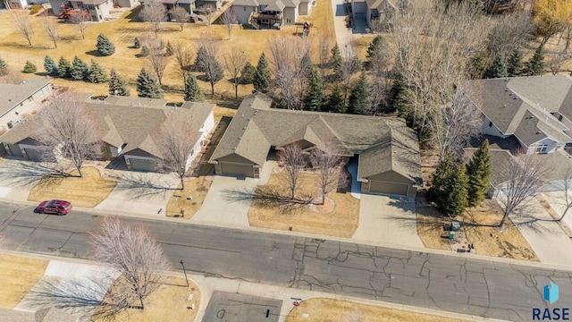 birds eye view of property with a residential view