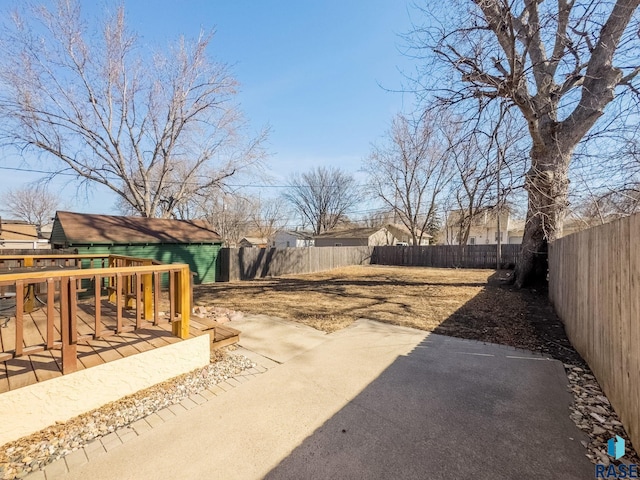 view of yard with a patio area and a fenced backyard