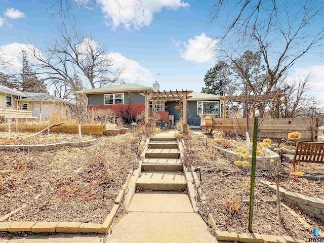 view of front of house featuring a pergola and a chimney