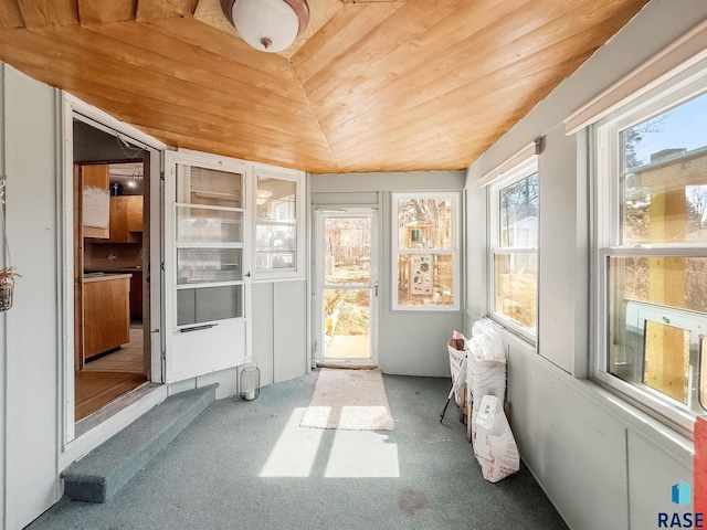 sunroom / solarium with wood ceiling and vaulted ceiling