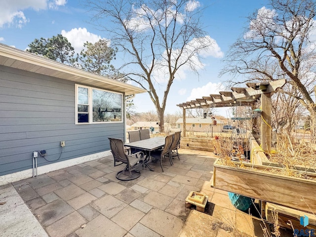 view of patio featuring outdoor dining space and a pergola