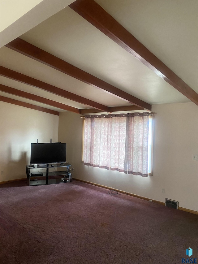 unfurnished living room featuring beamed ceiling, carpet flooring, baseboards, and visible vents