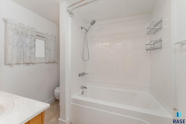 full bathroom featuring vanity, tile patterned flooring, a textured ceiling, toilet, and shower / bathtub combination