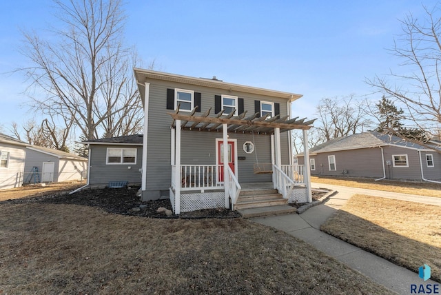 view of front of house with a porch and a pergola