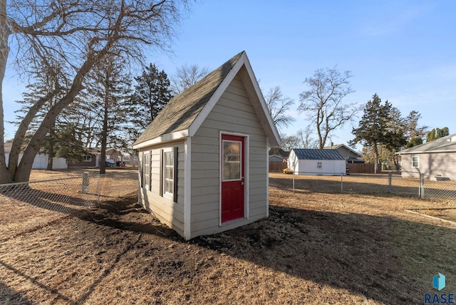 view of shed with fence