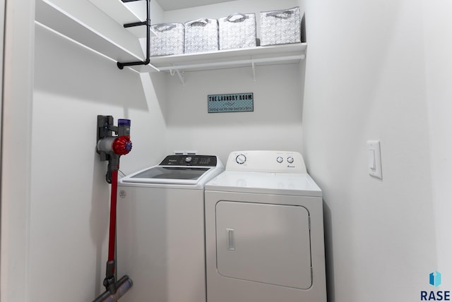 laundry area with laundry area and independent washer and dryer