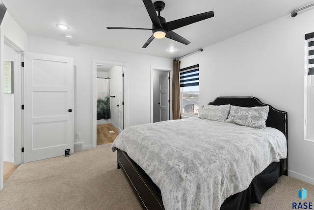 bedroom featuring visible vents, baseboards, carpet, and a ceiling fan