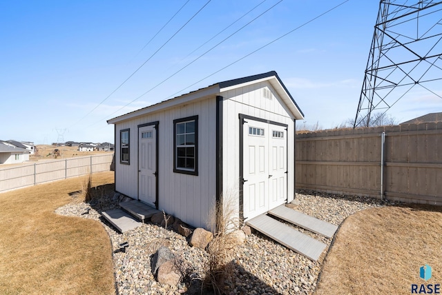 view of outbuilding featuring an outbuilding and a fenced backyard