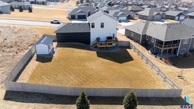 birds eye view of property with a residential view