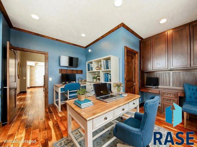 office area with recessed lighting, built in study area, crown molding, and wood finished floors