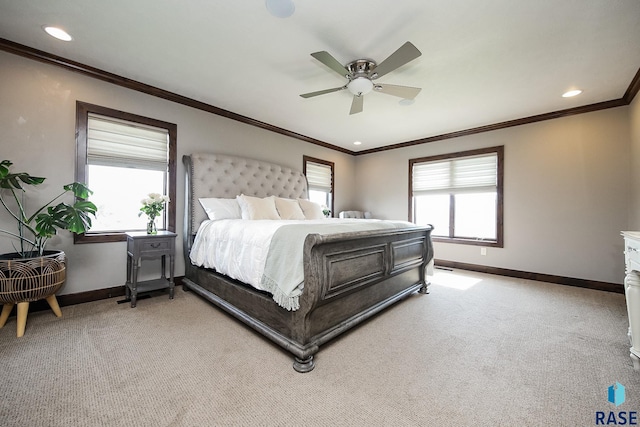 bedroom featuring baseboards, light carpet, multiple windows, and crown molding