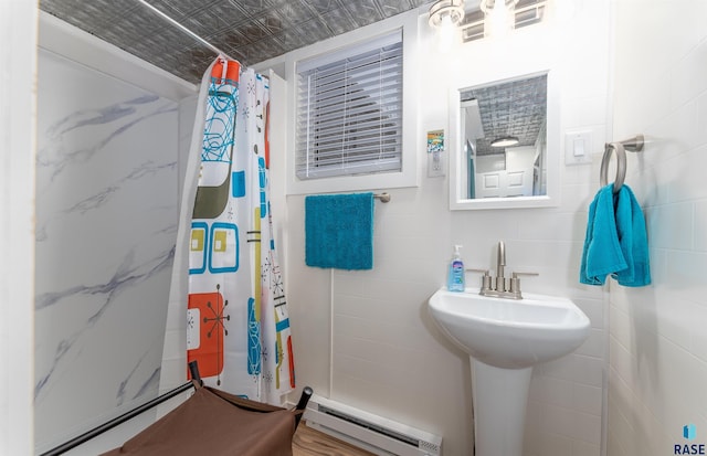 full bathroom with curtained shower, tile walls, an ornate ceiling, and a baseboard radiator