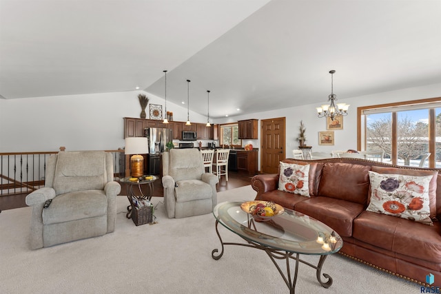 carpeted living room with a chandelier, plenty of natural light, and lofted ceiling