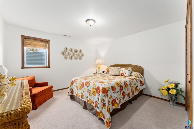 bedroom featuring carpet flooring, visible vents, and baseboards