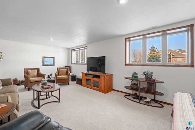 living area with recessed lighting, baseboards, visible vents, and carpet floors