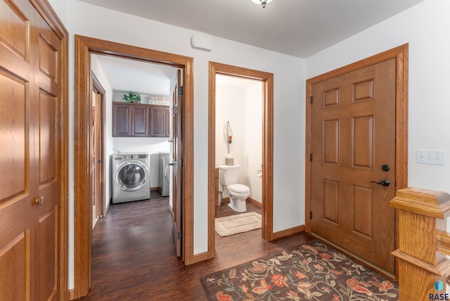 foyer featuring baseboards, independent washer and dryer, and dark wood finished floors