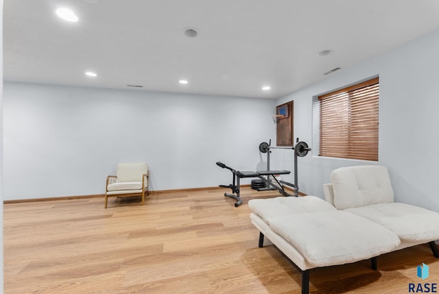 sitting room with recessed lighting, visible vents, baseboards, and wood finished floors