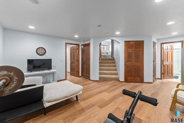 workout area featuring recessed lighting, visible vents, and light wood finished floors