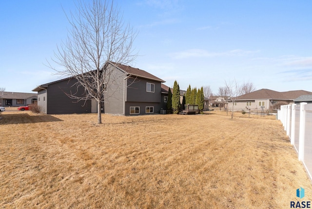 view of yard with fence and a residential view