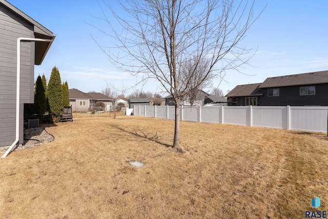 view of yard with a residential view and fence