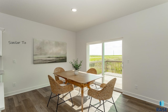 dining area featuring recessed lighting, baseboards, and wood finished floors