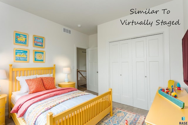 bedroom with a closet, visible vents, and carpet