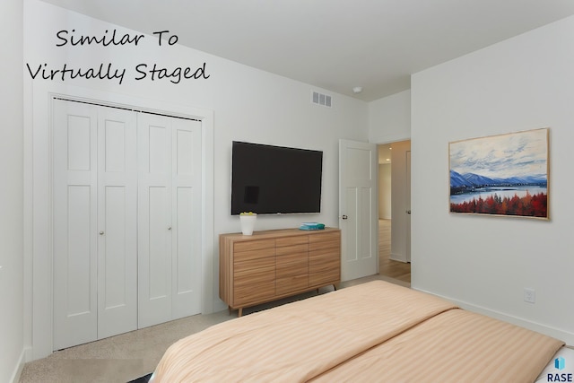 bedroom with visible vents and a closet