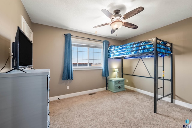 bedroom featuring visible vents, carpet flooring, baseboards, and ceiling fan