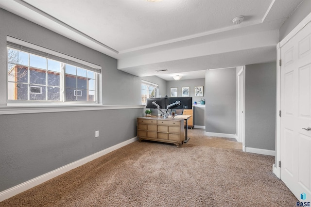 bedroom with light colored carpet and baseboards