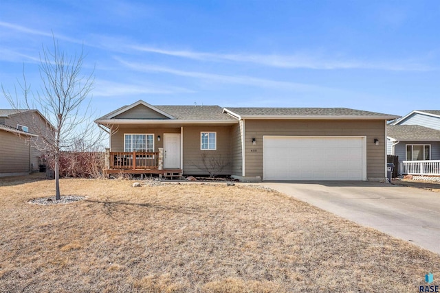 ranch-style home with an attached garage, covered porch, and driveway